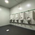 Interior of portable toilet with urinal uae