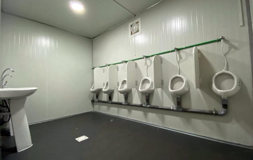 Interior of portable toilet with urinal uae