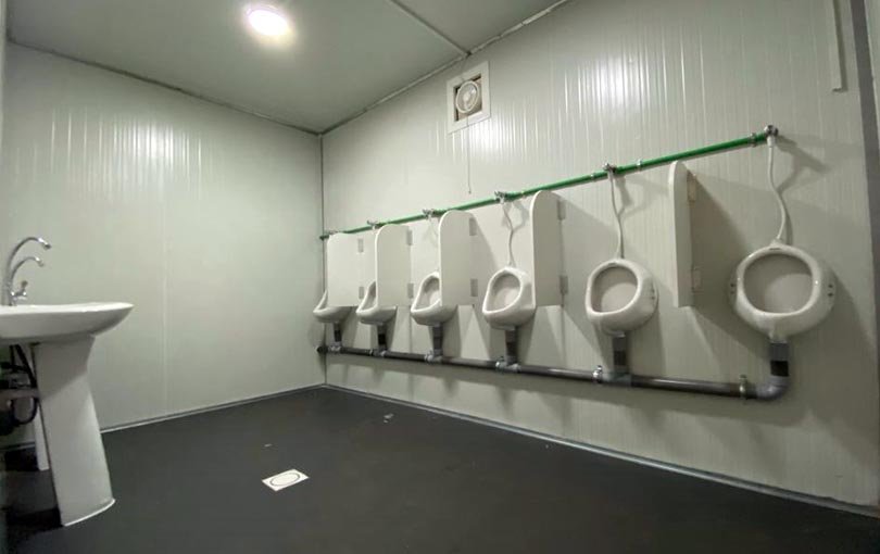 Interior of portable toilet with urinal uae